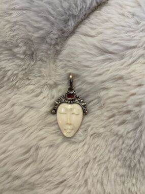 Carved Bone Face Pendant with Red Stone Accent